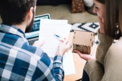 A couple learning how much does it cost to sell a house