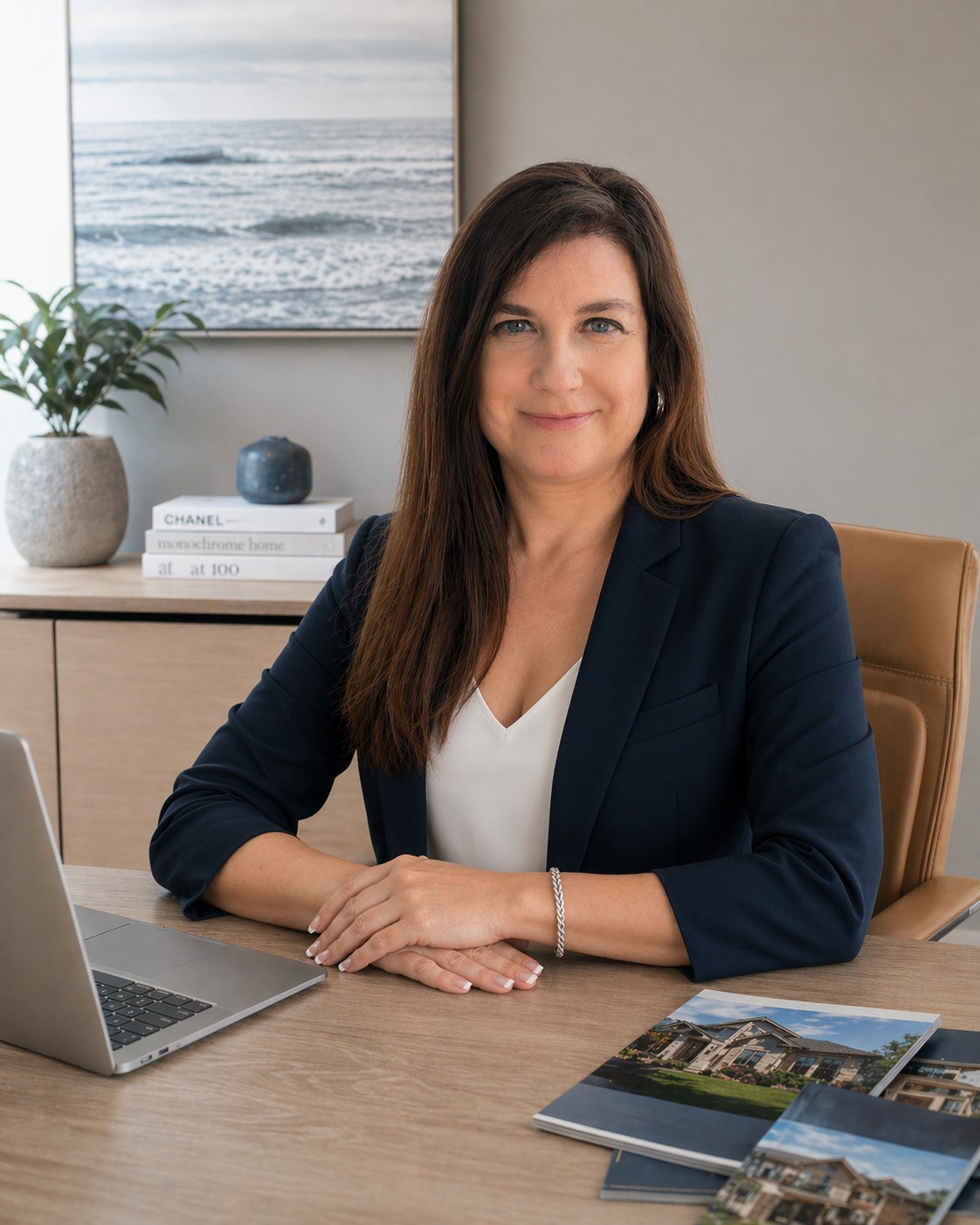 Jayne Kerns-Swystun working at her desk with a laptop